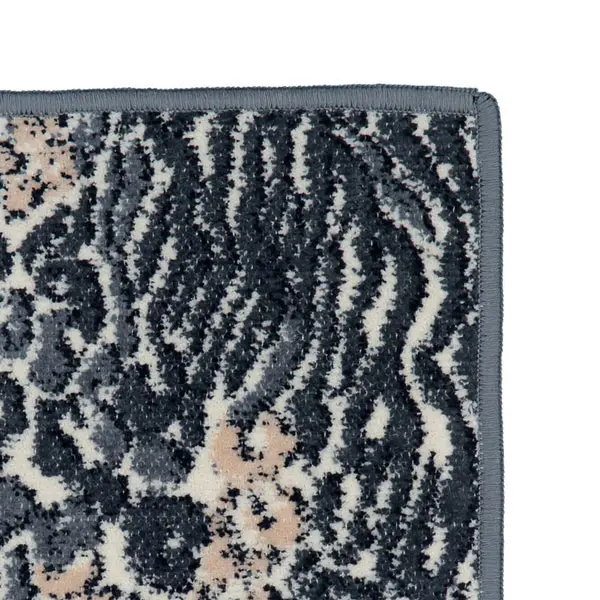 Chenilletuch Animal Blend grau mit Leomuster Detailö