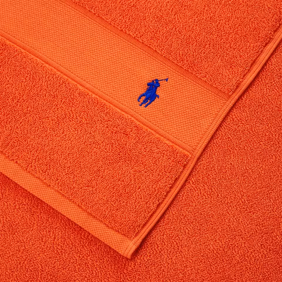 Polo Player Frottier orange Detail Logo Stickerei