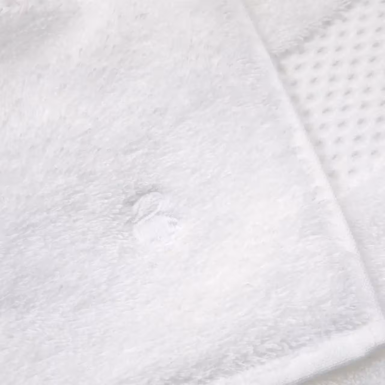 Frottiertuch Etoile in weiß Stick Detailaufnahme