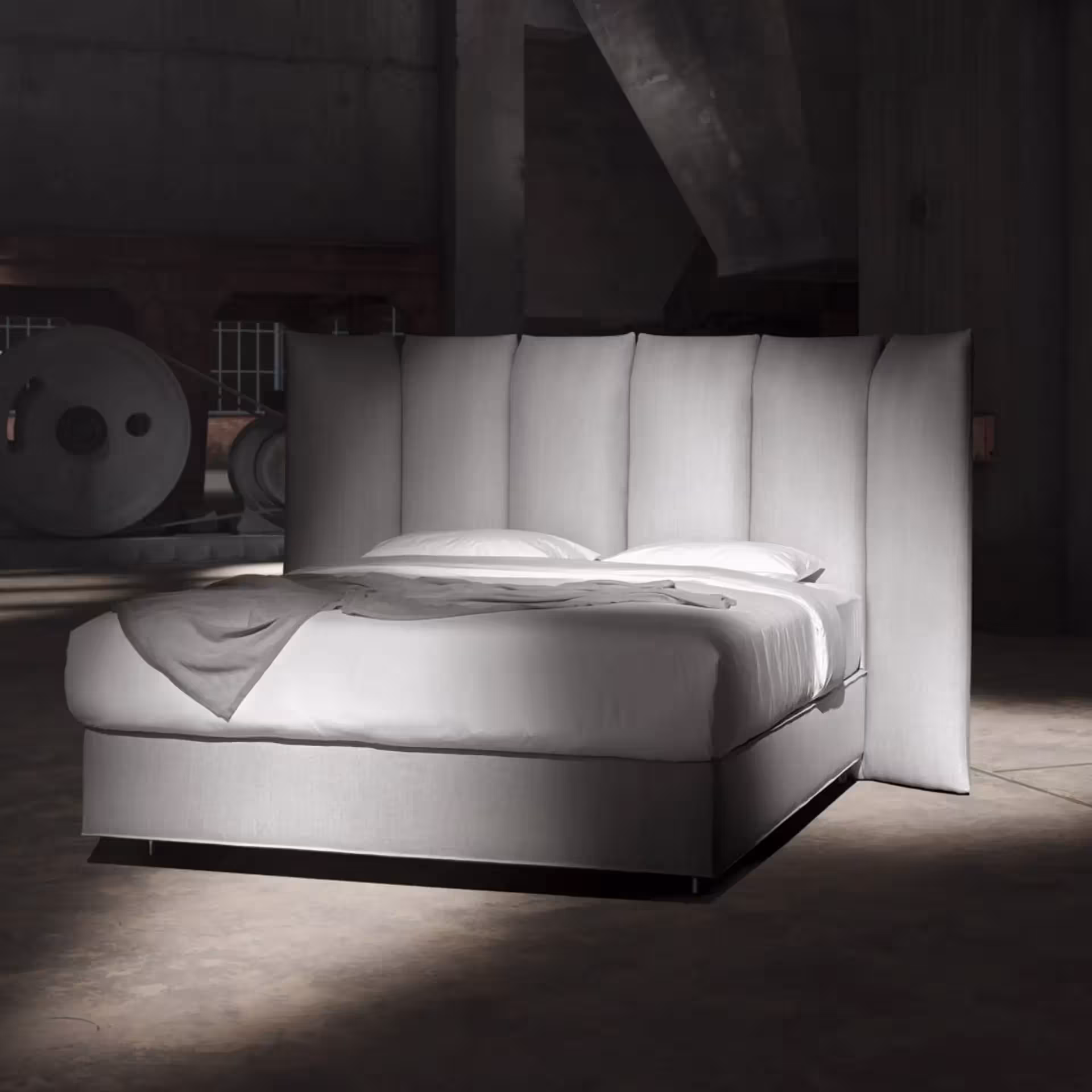 Graues Bett in Loftambiente
